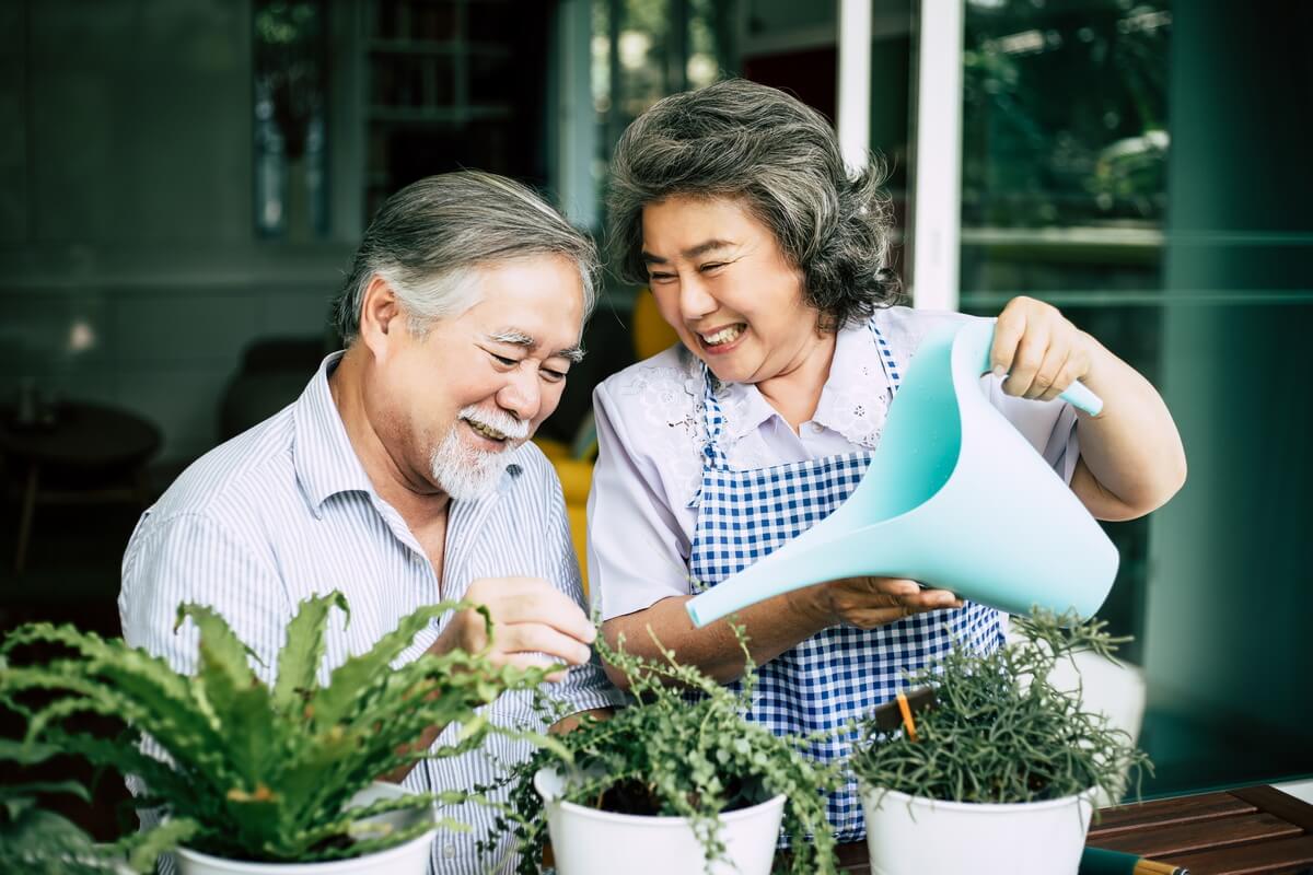 elderly-couples-talking-together-plant-trees-pots (1)